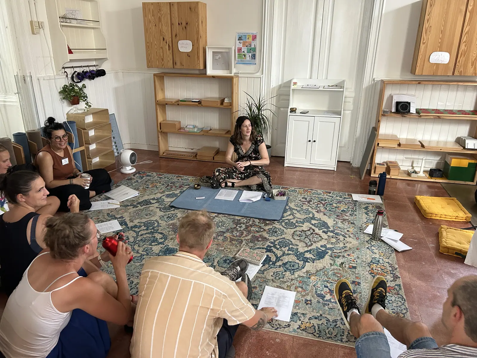 the cohort gathered on the rug around a morning presentation